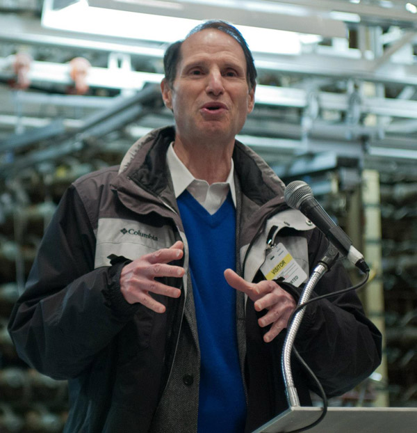 Senator Wyden in front of the face of the B Reactor. Photo courtesy of the U.S. Department of Energy at Hanford.